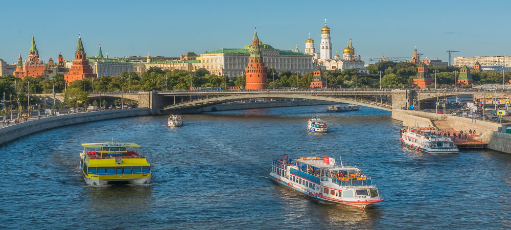 The Kremlin Moscow river boats and embankment